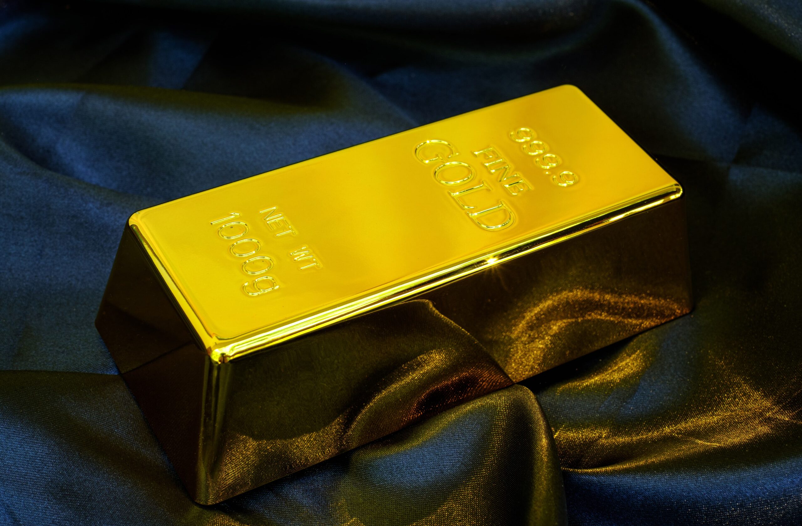 gold bar 1 kg on smooth elegant black silk fabric 2025 02 10 11 14 59 utc min min